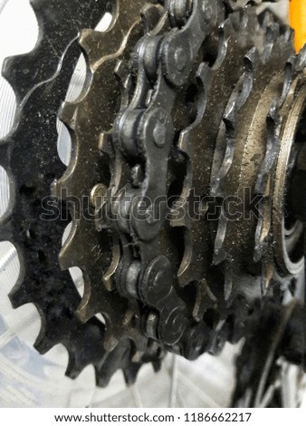 The bike chain is dirty after riding