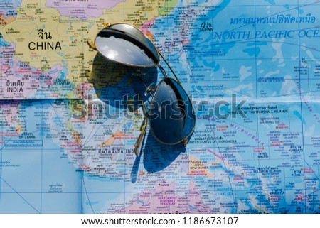 Plan your trip with maps, world maps and sunglasses