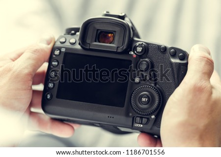 photographer with camera in hand