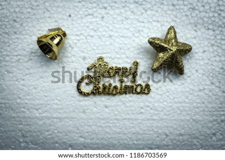 blurry light design background of Merry Christms letter at the middle of bell and star,grunge surface background,dramatic tone,abstract art style