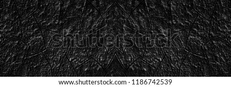 Black plaster wall wide texture. Spacious rough cement surface. Dark grunge background