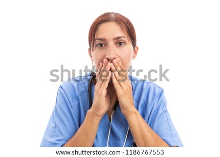 Stressed female nurse or doctor covering her mouth with hands as medical hospital mistake problem concept isolated on white background