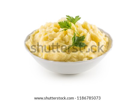 Mashed potatoes in bowl isolated on white background. Royalty-Free Stock Photo #1186785073