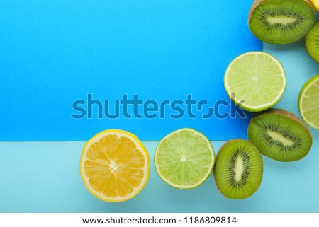 Summer composition with tropical fruits and blank card on light background