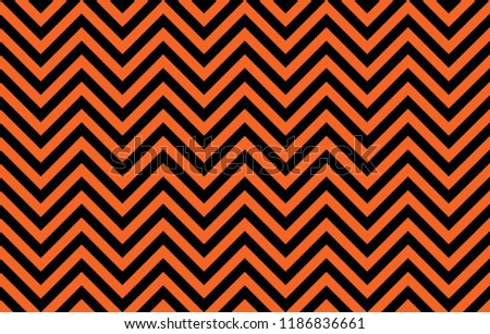 Eye-pleasing abstract chevron lines in orange and black, concept for Halloween decoration or graphic resource as abstract background, textile print, wallpaper and geometric inspiration