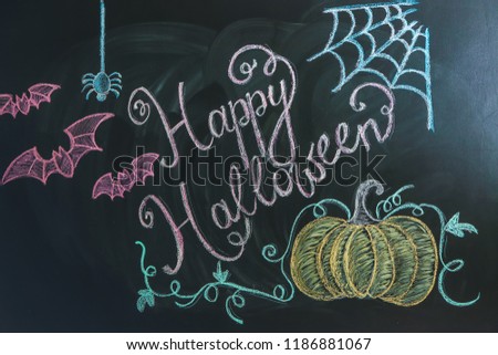 Drawings with text "Happy Halloween" on dark background