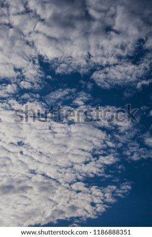 Beautiful white clouds on a blue sky in clear weather.