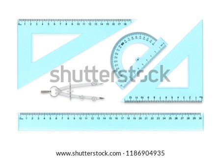 transparent rulers, protractor and compasses isolated on white 