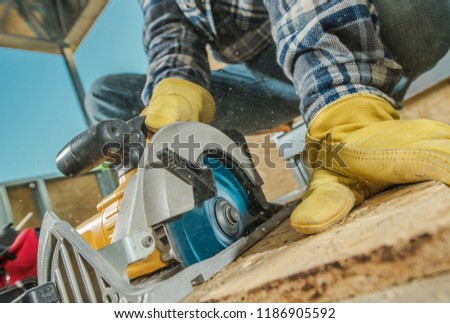 Plywood Cut by Circular Saw. Construction Worker and the Woodworking  Royalty-Free Stock Photo #1186905592