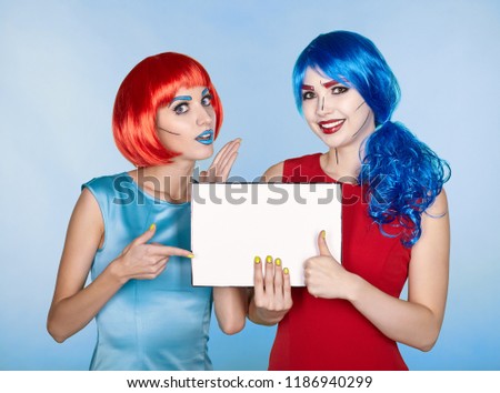 Females with paper in hands. Portrait of young women in comic pop art make-up style. 