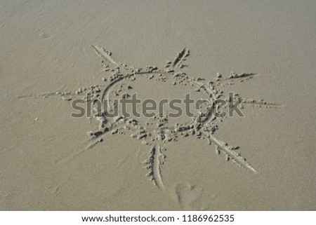 Sun in the wet sand on the beach painted 