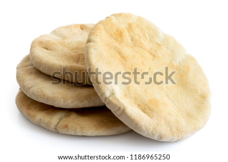 A stack of pita breads isolated on white from above. Royalty-Free Stock Photo #1186965250