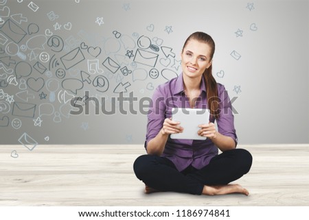 Beautiful girl with tablet is using social