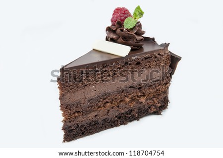 piece of chocolate cream cake on a white background in the restaurant