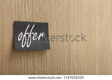Black post it with marketing message of Black Friday sale on wall.
