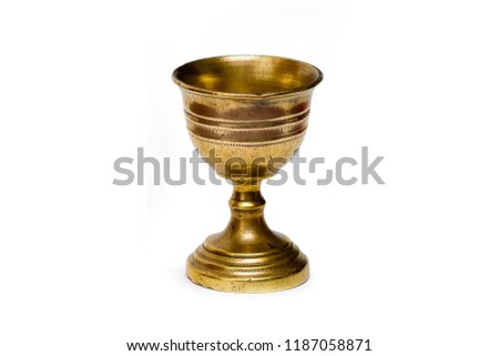 Ancient bronze chalice isolated in white background Royalty-Free Stock Photo #1187058871