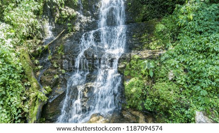 waterfall with 125 meters of height of water fall in Brazil in Santa Catarina Corupa. Route with 14 waterfalls in one of the last areas of Atlantic forest. Corupa means area of ​​many stones.