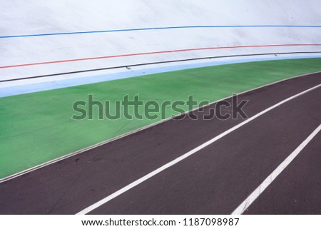 Leisure, lifestyle concept. High angle top view cropped photo of new empty modern public bicycle track in the open air with colored marking line for marathon or sprint run