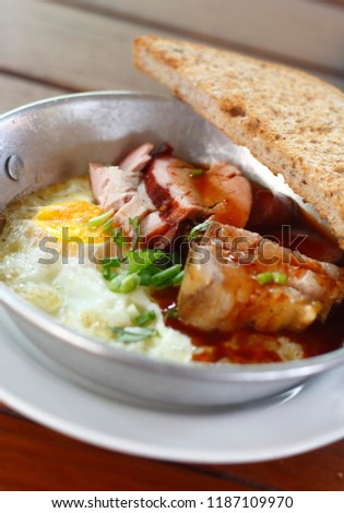  Indochina pan-fried egg with toppings and bread for breakfast