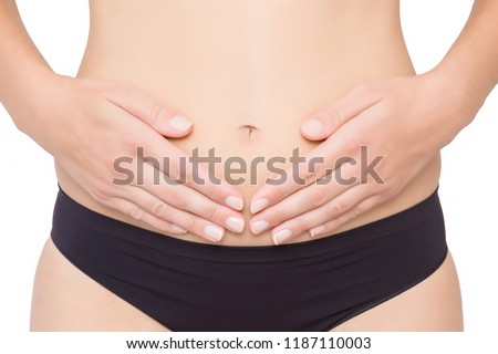 Young perfect groomed woman isolated on white background. Black, simple daily panties. Medical problem and solution. Cutout part of model body. Clipping path. Close up. Front view. Studio shot.