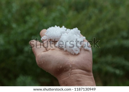 Hail grains in hand.