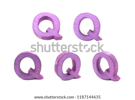 Single sawn wooden Q letter symbol in different angles and foreshortenings isolated over the white background