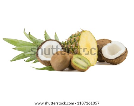A sliced exotic pineapple, passion fruit, coconut and kiwi isolated on a white background