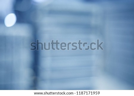 blurred photo: plates stacked on top of each other in blue colour