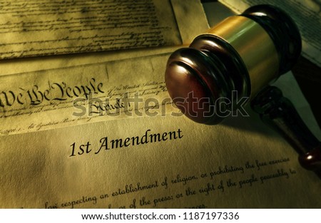 First Amendment of the US Constitution with court gavel                                Royalty-Free Stock Photo #1187197336