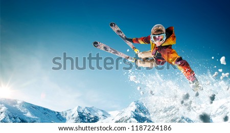 Skiing. Jumping skier. Extreme winter sports. Royalty-Free Stock Photo #1187224186