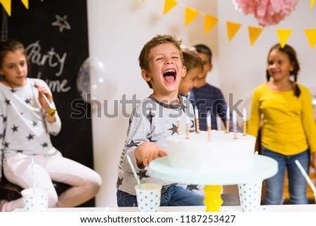 Little boy having fun on his birthday party