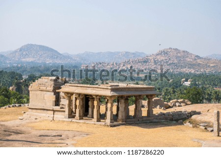 The ruins of ancient Vijayanagar city in green environment in Hampi, Karnataka. Best destination in IncrediIe India.