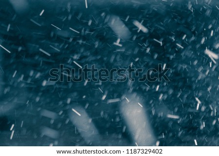 Snowflakes against black background for adding falling snow texture into your project. Add this picture as "Screen" mode layer in photo editor to add falling snow to any image.