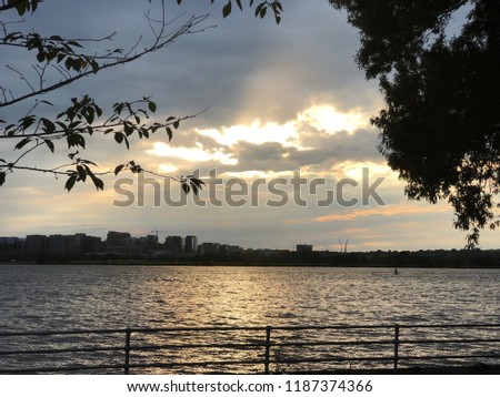 Waterfront with Silhouette City Skyline