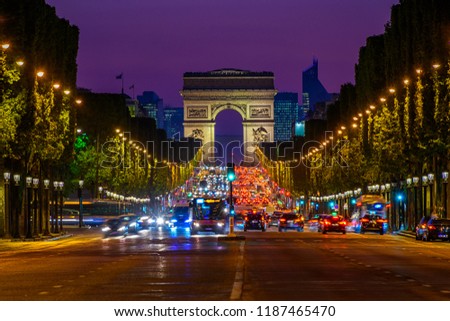 Champs-Elysees and Arc de Triomphe at night in Paris, France. Night cityscape of Paris. Architecture and landmarks of Paris.  Royalty-Free Stock Photo #1187465470