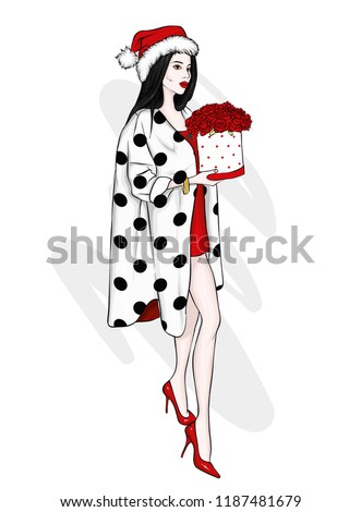 Beautiful girl in a coat with a bouquet of roses. Women's fashion and flowers. Christmas and New Year.
