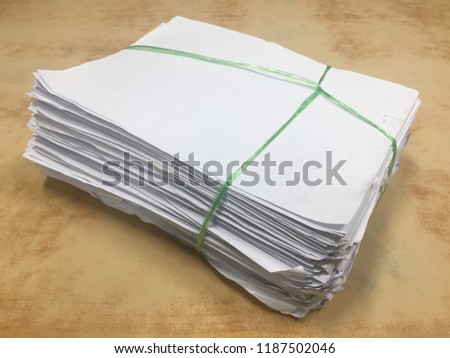 paper pile on wood background