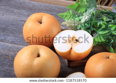 Fresh Asian Pears on Wood Background