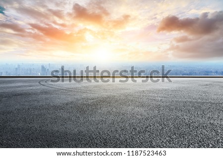 Panoramic skyline and buildings with empty race track road Royalty-Free Stock Photo #1187523463