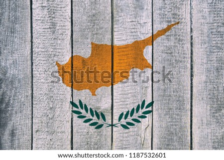 Old  wooden table texture background top view  with a National Flag of Cyprus. Cyprus Flags image.