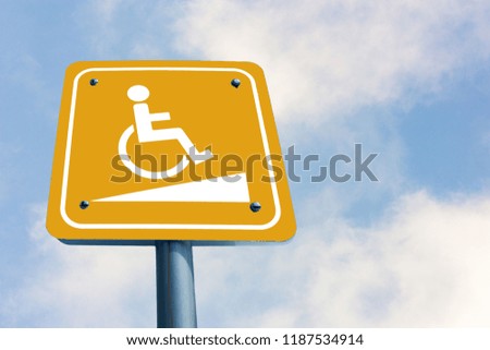 Signage for persons with disabilities that is separate from the backdrop.