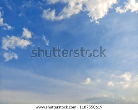 White fluffy clouds in the blue sky.