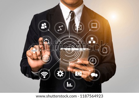 Digital marketing media  in virtual globe shape diagram.success businessman open his hand,working touch screen computer, and tablet front view 
