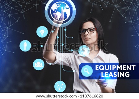 The concept of business, technology, the Internet and the network. A young entrepreneur working on a virtual screen of the future and sees the inscription: Equipment leasing