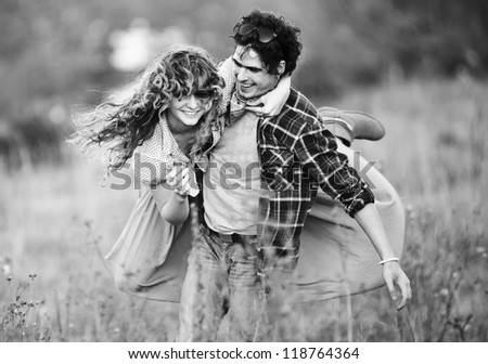 Picture of vintage way dressed yang pretty couple outdoor.