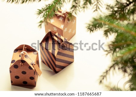 Little presents under the Christmas tree. Celebration on winter holidays Christmas and New Year. 