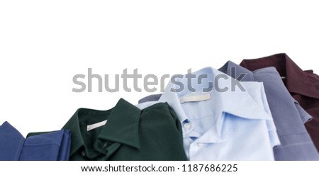 Close up of front views of green shirts or business clothes on wooden hangers, People concept, Set of mans fashion and accessories. Mockup template for design print. casual or formal tshirt.  Blue