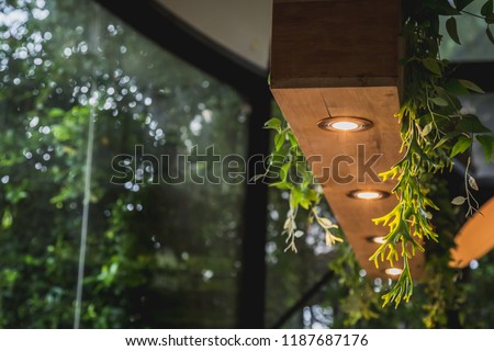 Decoration idea of wooden hanging ceiling lamp from plant pots Royalty-Free Stock Photo #1187687176