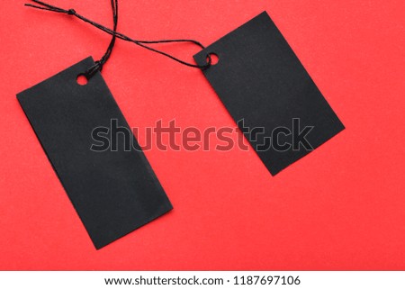 Black sale tags on red background