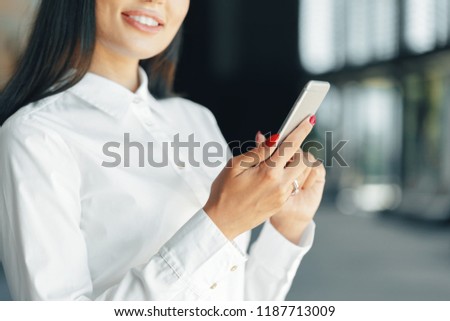 woman using mobile phone in the office